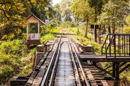 vintage railroad tracks of the famous bridge on the river Kwai in Thailandの写真素材