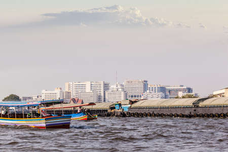 a very big barge floating on Chao Praya River in Bangkok, Thailandの写真素材