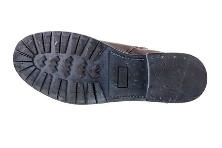 a man's leather fashion boot sole bottom isolated over a white backgroundの写真素材