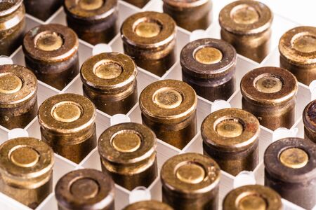 a lot of 9mm handgun bullets arranged in rows