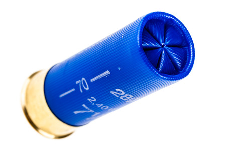 a 12 gauge shotgun shell isolated over a white background
