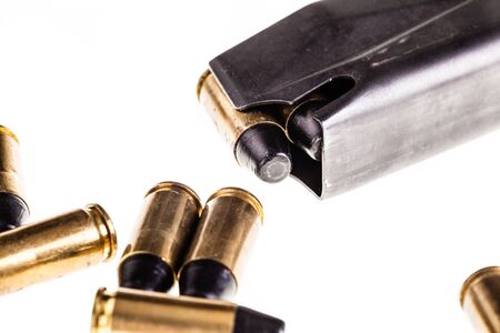 a loaded handgun magazine isolated over a white background