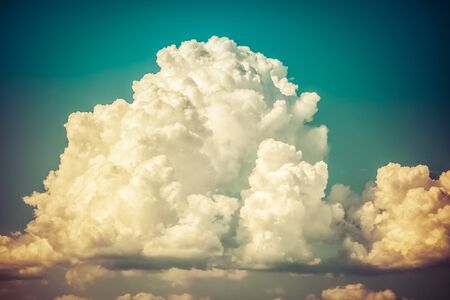 a big and fluffy cumulonimbus cloud in the blue skyの写真素材