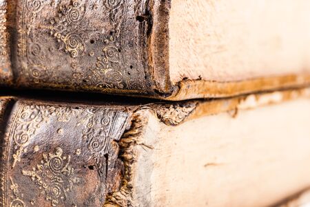 detail of ancient 1500's books with very weathered hardcoverの写真素材