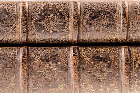 detail of ancient 1500's books with very weathered hardcoverの写真素材
