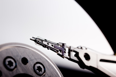 an opened hard disk on black background