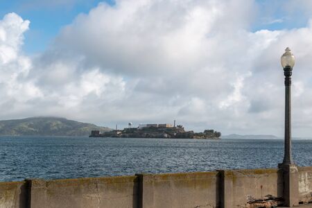 View of Alcatraz island with lamp in the foregroundの写真素材