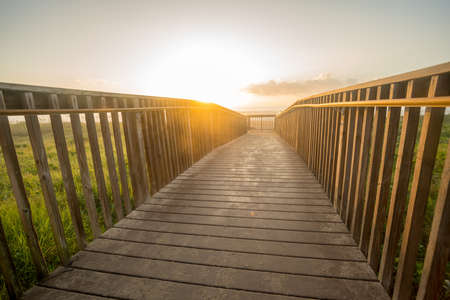 Low Angle View of Sunrise On the Horizon from Beach Board Walkの写真素材