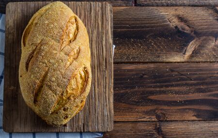 loaf of bread on wooden background