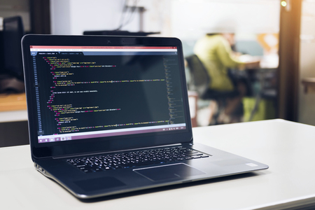 Developing programming and coding technologies on desk white, Website design, Programmer working in a software develop company office,Data processing center, Server roomの写真素材