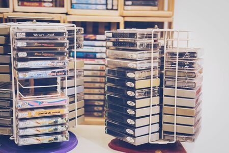 Bangkok, Thailand - JUNE 16, 2018 : Retro cassette tape from 80s front white background, Shop at JJ Green Market, the popular night shopping next to Chatuchak market, Vintage style, old technologyのeditorial素材