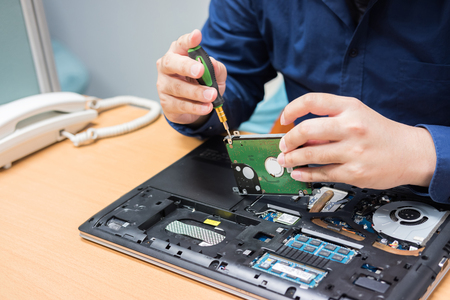 Technician support upgrade part and fixing laptop. select focus, Computer repair concept.