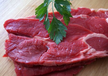 Fresh steaks with parsley, detail