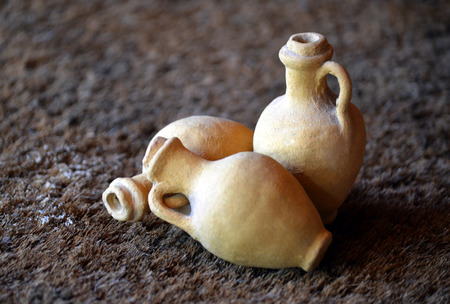 Miniature ceramic vases on dark backgroundの写真素材