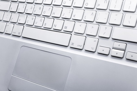 White notebook laptop - close up on a white background