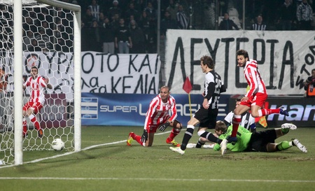THESSALONIKI, GREECE - FEBRUARY 5: The first goal of Olympiakos with Djamel Abdoun(R) in football match between Paok and Olympiakos (0-2) on February 5, 2012 in Thessaloniki, Greece のeditorial素材