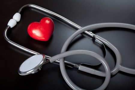 Stethoscope & red heart on black backgroundの写真素材