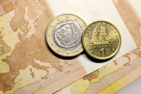 50 euros, one euro coin and one drachma coinの写真素材