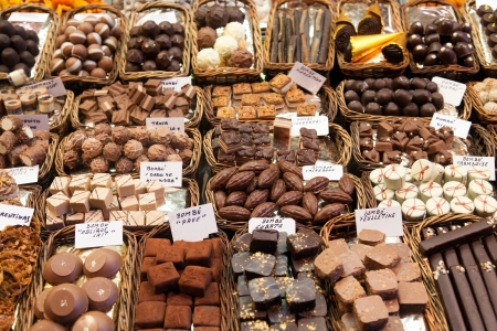BARCELONA, SPAIN - APRIL 14: Famous La Boqueria market with nuts, chocolate delicacies, fruit jellies and dry fruits on April 14, 2012 in Barcelona, Spain. One of the oldest markets in Europe that still exist. Established 1217.のeditorial素材