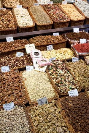 BARCELONA, SPAIN - APRIL 14: Famous La Boqueria market with nuts, chocolate delicacies, fruit jellies and dry fruits on April 14, 2012 in Barcelona, Spain. One of the oldest markets in Europe that still exist. Established 1217.のeditorial素材