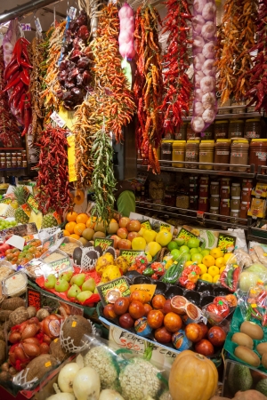 BARCELONA, SPAIN - APRIL 14: Famous La Boqueria market with vegetables and fruits on April 14, 2012 in Barcelona, Spain. One of the oldest markets in Europe that still exist. Established 1217. のeditorial素材