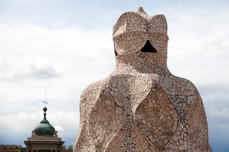 BARCELONA - APR 14: Chimneys covered with ceramic fragments that look like helmets at La Pedrera (Casa Mila) on Apr 14, 2012 in Barcelona, Spain. Casa Mila was built in 1910 by Antoni Gaudi.のeditorial素材