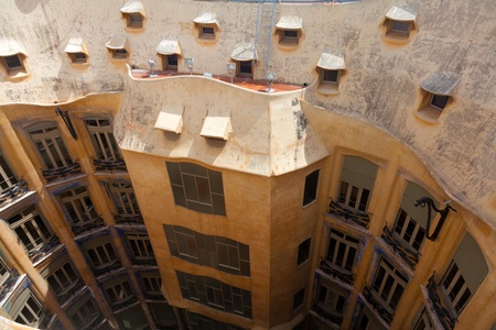 BARCELONA, SPAIN ? APR 14: Chimneys like masked soldiers on the roof of La Pedrera or Casa Mila...