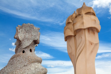 BARCELONA, SPAIN ? APR 14: Chimneys like masked soldiers on the roof of La Pedrera or Casa Mila designed by Antoni Gaudi, on April 14, 2012 in Barcelona, Spain. La Pedrera was built in 1906-1910.のeditorial素材