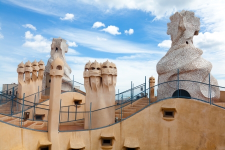 BARCELONA, SPAIN ? APR 14: Chimneys like masked soldiers on the roof of La Pedrera or Casa Mila designed by Antoni Gaudi, on April 14, 2012 in Barcelona, Spain. La Pedrera was built in 1906-1910.のeditorial素材