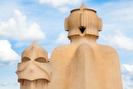 BARCELONA, SPAIN ? APR 14: Chimneys like masked soldiers on the roof of La Pedrera or Casa Mila designed by Antoni Gaudi, on April 14, 2012 in Barcelona, Spain. La Pedrera was built in 1906-1910.のeditorial素材