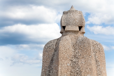 BARCELONA - APR 14: Chimneys covered with ceramic fragments that look like helmets at La Pedrera (Casa Mila) on Apr 14, 2012 in Barcelona, Spain. Casa Mila was built in 1910 by Antoni Gaudi.のeditorial素材