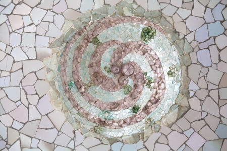 BARCELONA, SPAIN - APRIL 16: Colorful mosaic in famous Parc Guell on April 16, 2012 in Barcelona, Spain. It is part of the UNESCO World Heritage Site "Works of Gaudi", major Spanish landmark.のeditorial素材