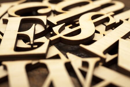Wooden alphabet letters on old wooden surface