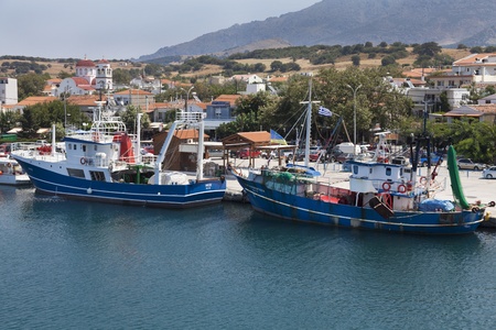 SAMOTHRACE, GREECE - AUGUST 14: The entrance to the main port of Kamariotissa full of fishing boats ready for fishing. View over the ferry on August 14, 2012 in Samothrace, Greeceのeditorial素材