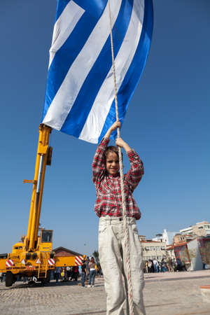 THESSALONIKI,GREECE-OCT.26: The biggest Greek flag ever built, area 480 square meters waving in the celebrations for the centenary of the liberation of the city on Oct 26,2012 in Thessaloniki, Greeceのeditorial素材