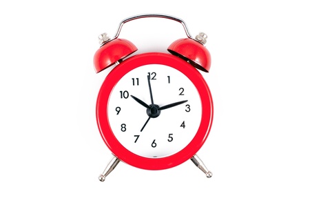 Alarm Clock  Classic red old style alarm clock isolated on whiteの写真素材