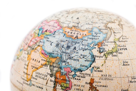Part of a globe with map of China isolated on white backgroundの写真素材