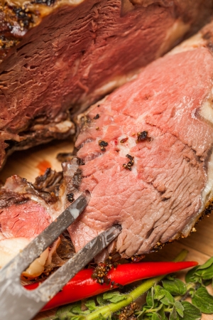 Medium Rare Cooked Beef Roast with Vegetables and Spices

の写真素材