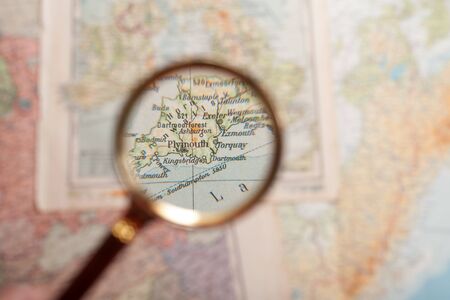 Magnifying glass in front of a Plymouth mapの写真素材