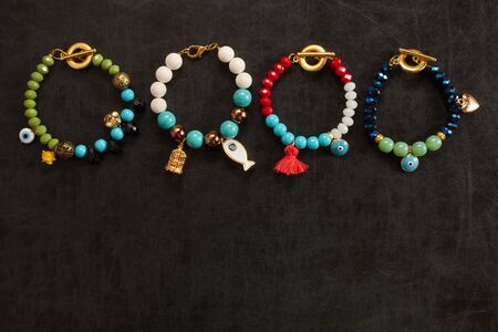 Jewelery from beads on blackboardの写真素材