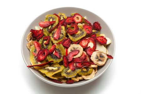 Different varieties mix of dried fruits in white plateの写真素材