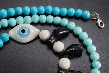 Jewelery from beads on blackboardの写真素材