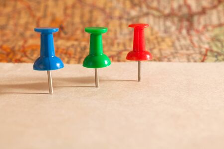 Push pins showing the location of a destination point on a map. Ready for your message.