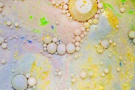 Colourful and beautiful effect of water paint and oil mixing. Multicoloured abstract bubbles.の写真素材