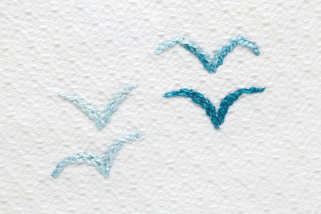 Embroidery with baby's motifs. Four seagullの写真素材