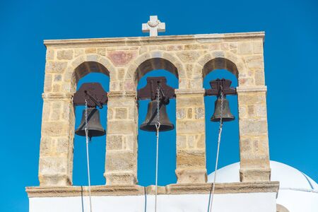 Belfry with tree bells in Mykonos - Greeceの写真素材