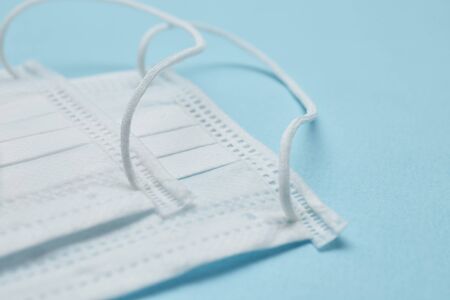 Disposable surgical face mask cover the mouth and nose. Healthcare and medical concept. Protect from Covid-19, Coronavirus, 2019-ncov, corona-virus. Can help protect wearers from getting others sick through their spit. Also for sick people and caretakersの写真素材