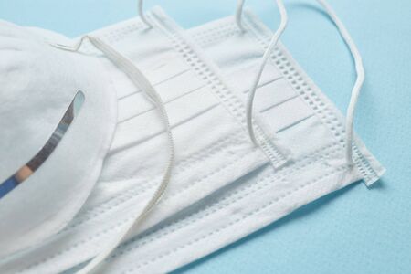 Disposable surgical face mask cover the mouth and nose. Healthcare and medical concept. Protect from Covid-19, Coronavirus, 2019-ncov, corona-virus. Can help protect wearers from getting others sick through their spit. Also for sick people and caretakersの写真素材