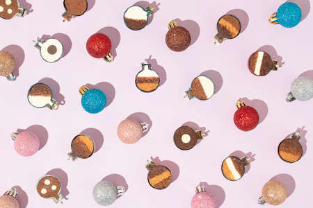 Creative Christmas pattern made of Christmas balls cut in half like a pralines. Minimal New Year...