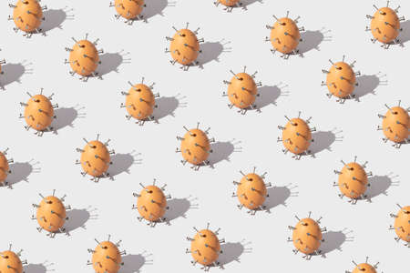 Creative Coronavirus or COVID-19 pattern made of Easter egg with lots of nails on it against gray background. Epidemic virus Respiratory Syndrome. Pandemic minimal concept.の写真素材